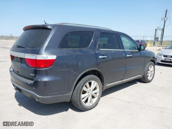 2013 Dodge Durango Crew with VIN 1C4SDHDT5DC637535, listed as a IAAI auction lot 41867982 with 162,569 mi miles. Bid and sale history available at carsss.com. Image 4.