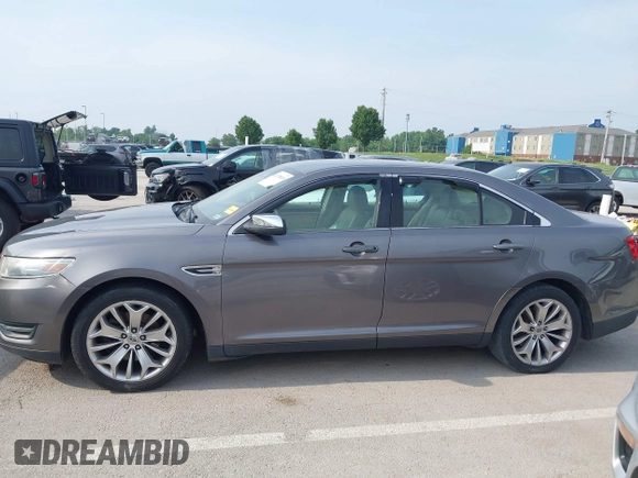 2013 Ford Taurus Limited z VIN 1FAHP2F8XDG185782, wystawiony jako IAAI lot #42474018 z przebiegiem 181 144 mil mil oraz . Historia ofert i sprzedaży dostępna na DreamBid. Obrazek 14.