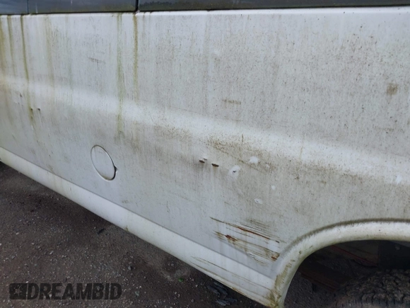 1997 GMC Savana z VIN 1GTGG29R2V1095122, wystawiony jako IAAI lot #42228877 z przebiegiem 120 646 mil mil oraz . Historia ofert i sprzedaży dostępna na DreamBid. Obrazek 13.