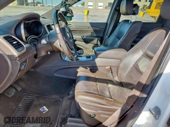 2014 Jeep Grand Cherokee Summit with VIN 1C4RJFJG9EC338666, listed as a Copart auction lot 63834075 with 196,840 mi miles and Salvage title. Bid and sale history available at DreamBid. Image 7.