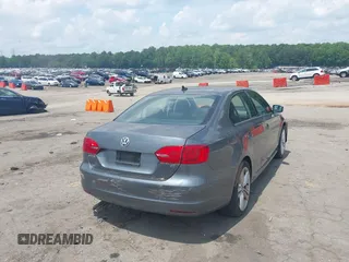 2014 Volkswagen Jetta SE with VIN 3VWD07AJ3EM232529, listed as a IAAI auction lot 42286442 with 125,000 mi miles and . Bid and sale history available at DreamBid. Image 4.