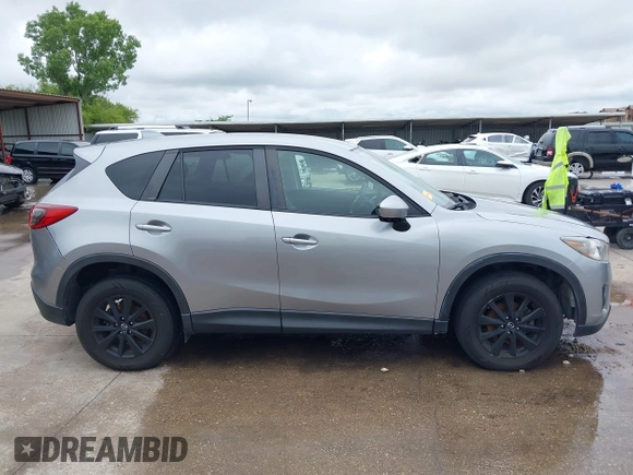2014 Mazda CX-5 Touring z VIN JM3KE2CY8E0369145, wystawiony jako IAAI lot #42462985 z przebiegiem 155 480 mil mil oraz . Historia ofert i sprzedaży dostępna na DreamBid. Obrazek 13.