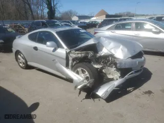2003 Hyundai Tiburon GS with VIN KMHHM65D03U056017, listed as a Copart auction lot 49678695 with 99,729 mi miles and Salvage Title. Bid and sale history available at carsss.com. Image 4.