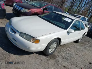 1996 Ford Thunderbird LX with VIN 1FALP62W8TH128351, listed as a IAAI auction lot 41730676 with 166,550 mi miles. Bid and sale history available at carsss.com. Image 2.