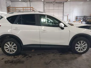 2014 Mazda CX-5 Touring with VIN JM3KE4CY4E0321055, listed as a IAAI auction lot 41613593 with 174,339 mi miles. Bid and sale history available at carsss.com. Image 14.