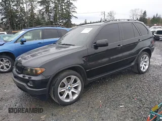2005 BMW X5 4.8is with VIN 5UXFA93515LE82570, listed as a IAAI auction lot 41759657 with 212,687 mi miles. Bid and sale history available at carsss.com. Image 2.
