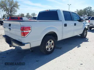 2012 Ford F-150 XL with VIN 1FTEW1CM2CFC06897, listed as a IAAI auction lot 41641309 with 123,853 mi miles. Bid and sale history available at carsss.com. Image 4.