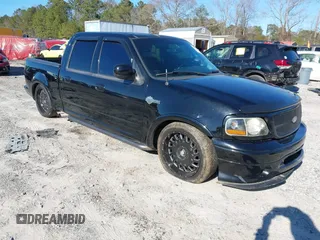 2002 Ford F-150 Harley Davidson with VIN 1FTRW07312KC24102, listed as a IAAI auction lot 41591917 with 1 mi miles. Bid and sale history available at carsss.com. Image 1.