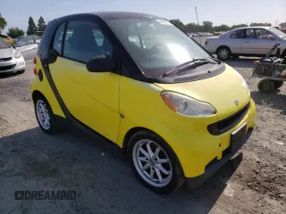 2008 Smart fortwo Pure с VIN WMEEJ31X68K099800, выставлен на аукционе Copart как лот 61967775 с пробегом Не указан миль и Чистый • Clean title. История ставок и продаж доступна на DreamBid. Изображение 4.
