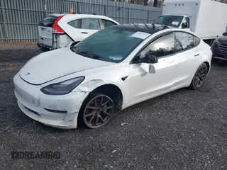 2021 Tesla Model 3 Long Range with VIN 5YJ3E1EB8MF974007, listed as a IAAI auction lot 41915513 with 107,354 mi miles and . Bid and sale history available at carsss.com. Image 2.