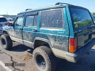 1995 Jeep Cherokee Sport z VIN 1J4FJ68S7SL623451, wystawiony jako IAAI lot #42581407 z przebiegiem 160 581 mil mil oraz . Historia ofert i sprzedaży dostępna na DreamBid. Obrazek 3.