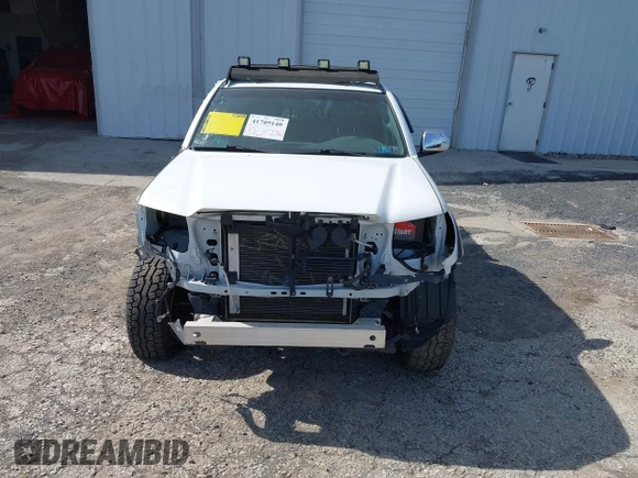2013 Toyota Tacoma with VIN 3TMLU4EN9DM113137, listed as a IAAI auction lot 41709140 with 57,704 mi miles and . Bid and sale history available at DreamBid. Image 6.