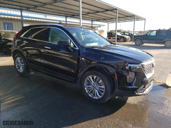 2024 Cadillac XT4 AWD Premium Luxury with VIN 1GYFZDR49RF128402, listed as a Copart auction lot 77630154 with 20,673 mi miles and Salvage Title. Bid and sale history available at carsss.com. Image 4.