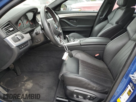 2014 BMW M5 z VIN WBSFV9C5XED097563, wystawiony jako Copart lot #72175354 z przebiegiem 73 406 mil mil oraz Szkody całkowita. Historia ofert i sprzedaży dostępna na DreamBid. Obrazek 7.