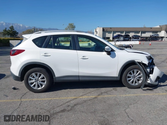 2016 Mazda CX-5 Sport with VIN JM3KE2BY9G0879654, listed as a IAAI auction lot 41819154 with 65,586 mi miles. Bid and sale history available at carsss.com. Image 13.