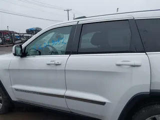 2013 Jeep Grand Cherokee Laredo with VIN 1C4RJFAG6DC557163, listed as a IAAI auction lot 42019052 with 125,058 mi miles. Bid and sale history available at carsss.com. Image 13.