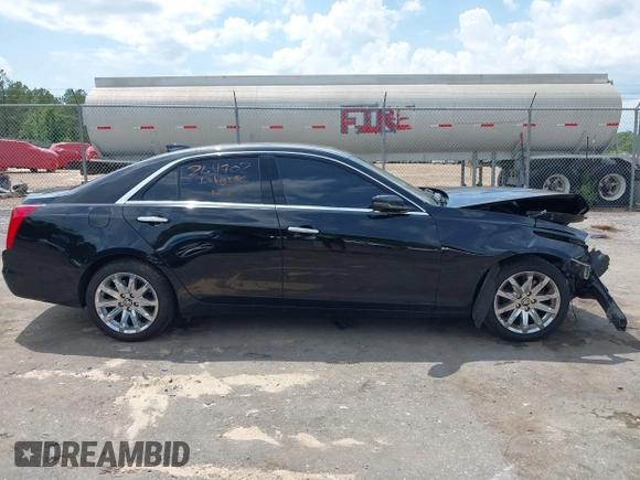 2016 Cadillac CTS AWD with VIN 1G6AW5SX7G0129019, listed as a IAAI auction lot 42148335 with 86,023 mi miles and . Bid and sale history available at DreamBid. Image 14.