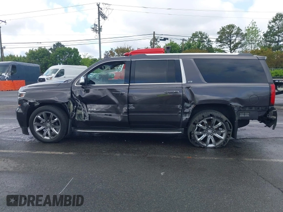 2015 Chevrolet Suburban LTZ with VIN 1GNSKKKC4FR589913, listed as a IAAI auction lot 42017190 with 216,145 mi miles. Bid and sale history available at carsss.com. Image 14.