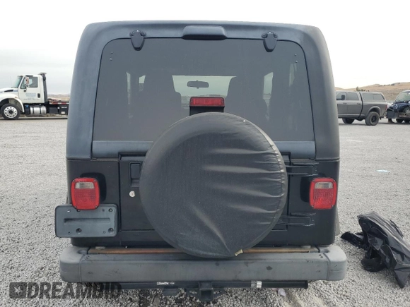 2003 Jeep Wrangler SE with VIN 1J4FA29113P351844, listed as a Copart auction lot 81411324 with 53,525 mi miles and Salvage title. Bid and sale history available at DreamBid. Image 6.