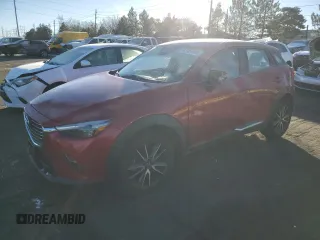 2018 Mazda CX-3 Grand Touring z VIN JM1DKFD75J0319224, wystawiony jako Copart lot #87504495 z przebiegiem 47 466 mil mil oraz Szkody całkowita. Historia ofert i sprzedaży dostępna na DreamBid. Obrazek 1.