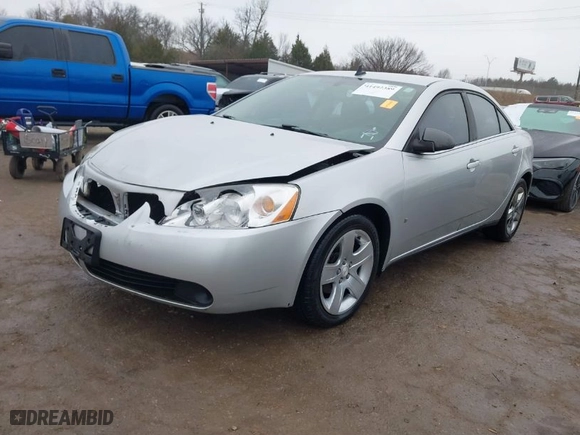 2009 Pontiac G6 w/1SA *Ltd Avail* with VIN 1G2ZG57B994123359, listed as a IAAI auction lot 41492389 with 128489 miles. Bid and sale history available at carsss.com. Image 2.