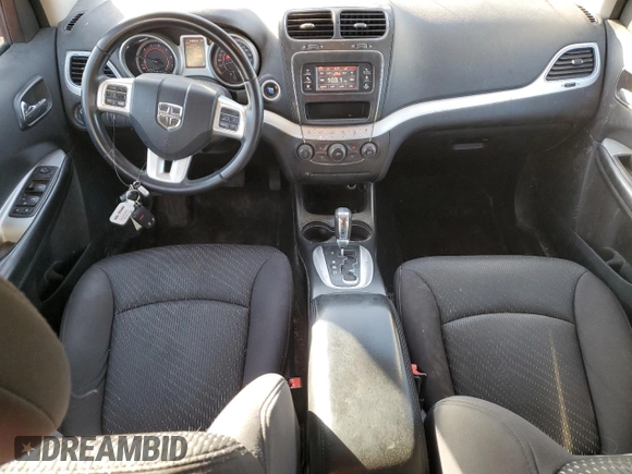 2013 Dodge Journey American Value with VIN 3C4PDCAB4DT590975, listed as a Copart auction lot 55627725 with 212,659 mi miles and Clean Title. Bid and sale history available at DreamBid. Image 8.