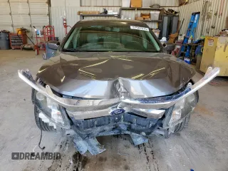 2012 Ford Fusion SE z VIN 3FAHP0HA1CR320160, wystawiony jako Copart lot #57597615 z przebiegiem 142 938 mil mil oraz Szkoda całkowita • Salvage title. Historia ofert i sprzedaży dostępna na DreamBid. Obrazek 5.