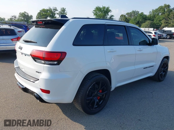 2016 Jeep Grand Cherokee SRT with VIN 1C4RJFDJ3GC503878, listed as a IAAI auction lot 42830257 with 82,661 mi miles and . Bid and sale history available at DreamBid. Image 4.