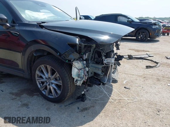 2020 Mazda CX-5 Grand Touring with VIN JM3KFADM1L0781634, listed as a IAAI auction lot 42333769 with 103,080 mi miles and . Bid and sale history available at DreamBid. Image 6.
