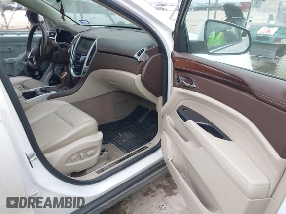 2015 Cadillac SRX Luxury Collection z VIN 3GYFNBE31FS552323, wystawiony jako IAAI lot #41553081 z przebiegiem 91 214 mil mil oraz . Historia ofert i sprzedaży dostępna na DreamBid. Obrazek 5.