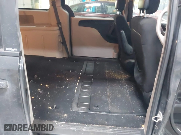 2012 Dodge Grand Caravan SXT with VIN 2C4RDGCG7CR358266, listed as a IAAI auction lot 41582428 with 169,137 mi miles and . Bid and sale history available at DreamBid. Image 8.