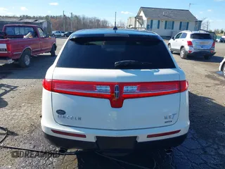 2013 Lincoln MKT EcoBoost with VIN 2LMHJ5AT8DBL55167, listed as a IAAI auction lot 41894396 with 121,114 mi miles. Bid and sale history available at carsss.com. Image 16.
