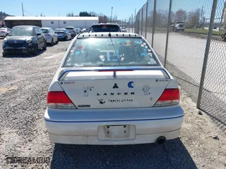 2002 Mitsubishi Lancer OZ-Rally with VIN JA3AJ86E42U039140, listed as a IAAI auction lot 41853888 with 328,181 mi miles. Bid and sale history available at carsss.com. Image 16.
