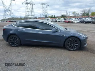 2020 Tesla Model 3 Long Range with VIN 5YJ3E1EB2LF646449, listed as a IAAI auction lot 42059086 with 120,981 mi miles and . Bid and sale history available at DreamBid. Image 14.