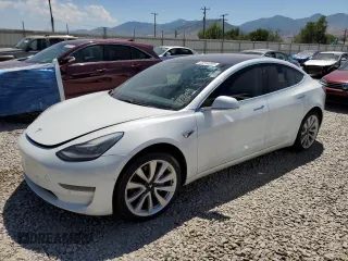 2018 Tesla Model 3 Long Range Battery z VIN 5YJ3E1EB0JF092373, wystawiony jako Copart lot #60244095 z przebiegiem Nie podano mil oraz Czysty tytuł • Clean title. Historia ofert i sprzedaży dostępna na DreamBid. Obrazek 1.