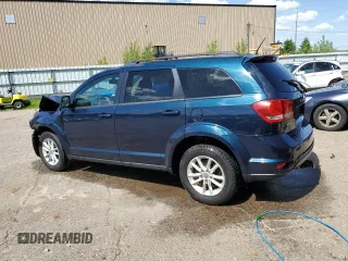 2013 Dodge Journey SXT with VIN 3C4PDCCG1DT637534, listed as a Copart auction lot 56992205 with 128,531 mi miles and Clean title. Bid and sale history available at DreamBid. Image 2.