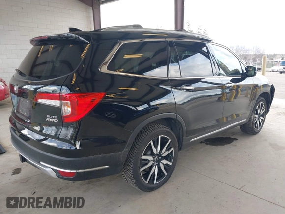 2021 Honda Pilot Elite with VIN 5FNYF6H04MB043014, listed as a IAAI auction lot 41826931 with 63,546 mi miles and . Bid and sale history available at DreamBid. Image 4.