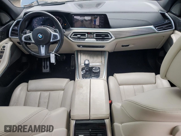 2020 BMW X5 M50i with VIN 5UXJU4C07LLE46002, listed as a Copart auction lot 77853984 with 74,098 mi miles and Salvage Title. Bid and sale history available at DreamBid. Image 8.