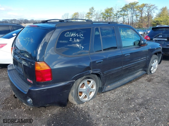2005 GMC Envoy Denali with VIN 1GKET63M052336214, listed as a IAAI auction lot 41852417 with 999,999 mi miles. Bid and sale history available at carsss.com. Image 4.