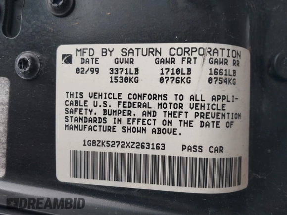 1999 Saturn SL with VIN 1G8ZK5272XZ263163, listed as a IAAI auction lot 42180002 with 138,463 mi miles. Bid and sale history available at carsss.com. Image 9.