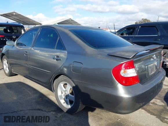 2003 Toyota Camry LE with VIN 4T1BE32K43U760354, listed as a IAAI auction lot 41547088 with 257,688 mi miles and . Bid and sale history available at DreamBid. Image 3.