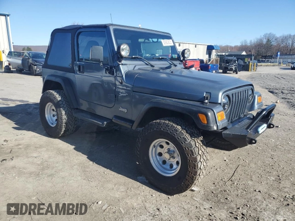 2002 Jeep Wrangler Sport with VIN 1J4FA49S22P703610, listed as a Copart auction lot 50900605 with 70,045 mi miles and Salvage Title. Bid and sale history available at carsss.com. Image 4.