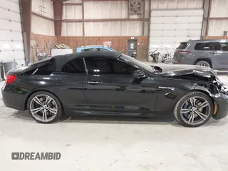 2014 BMW M6 z VIN WBSLZ9C58EDZ78401, wystawiony jako IAAI lot #41840114 z przebiegiem 23 499 mil mil oraz . Historia ofert i sprzedaży dostępna na DreamBid. Obrazek 13.