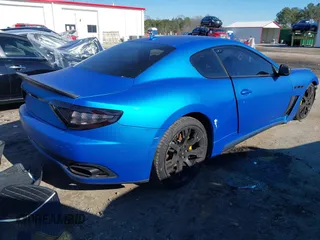 2013 Maserati GranTurismo Sport with VIN ZAM45VLA5D0070499, listed as a IAAI auction lot 41284315 with 50,156 mi miles. Bid and sale history available at carsss.com. Image 4.