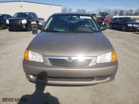 2000 Mazda Protege DX with VIN JM1BJ2227Y0247785, listed as a Copart auction lot 43501105 with 214,380 mi miles and Salvage Title. Bid and sale history available at carsss.com. Image 5.