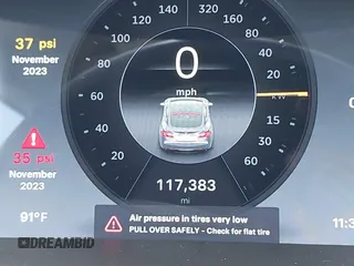 2014 Tesla Model S 60 with VIN 5YJSA1H12EFP39582, listed as a IAAI auction lot 42545143 with 117,383 mi miles and . Bid and sale history available at DreamBid. Image 15.