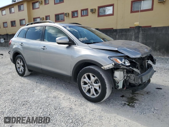 2015 Mazda CX-9 Touring with VIN JM3TB2CA1F0467659, listed as a Copart auction lot 56553015 with 102,028 mi miles and Salvage Title. Bid and sale history available at DreamBid. Image 4.