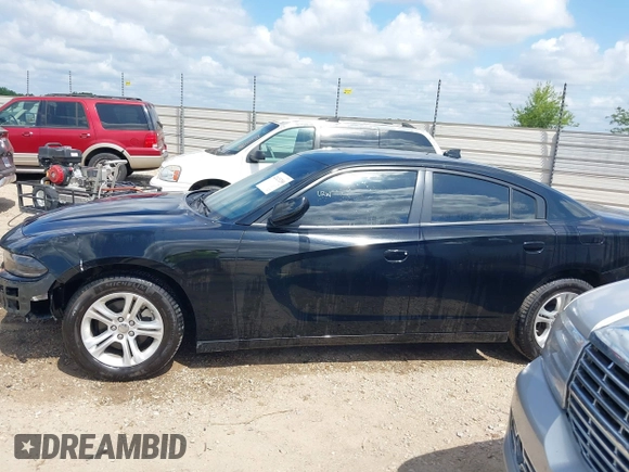 2023 Dodge Charger SXT with VIN 2C3CDXBG2PH550671, listed as a IAAI auction lot 42123200 with 50,818 mi miles. Bid and sale history available at carsss.com. Image 14.