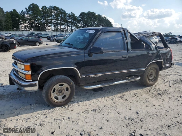 1999 Chevrolet Tahoe Z71 with VIN 1GNEK13R1XJ380316, listed as a Copart auction lot 68505524 with 242,542 mi miles and Salvage Title. Bid and sale history available at carsss.com. Image 1.
