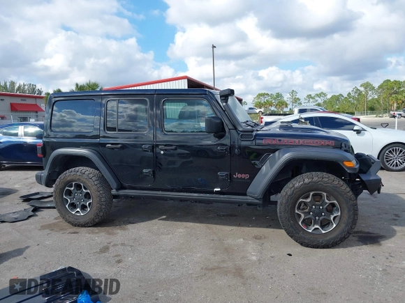 2023 Jeep Wrangler Rubicon with VIN 1C4HJXFGXPW534515, listed as a IAAI auction lot 41524419 with 21,376 mi miles and . Bid and sale history available at DreamBid. Image 13.